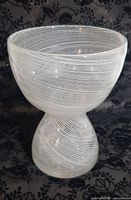 overall view of white swirl glass chalice vase