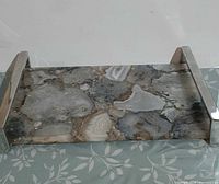 Top view of onyx stone tray showing mosaic pattern and chrome handles