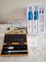 overview showing geometry set, two engraving pens in tray, hobby knife kit
