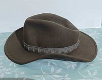 Side profile of brown wool hat on patterned surface