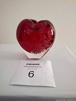 Front view showing heart shape and ruby red sommerso glass
