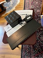 Switch and router with power adapter on table