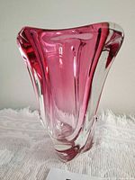 Front view showing pink interior and clear exterior of vase