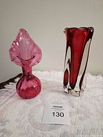 Both vases side by side on white cloth