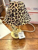 Front view of leopard print night-light lamp with shade