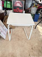 Front view of white adjustable folding table