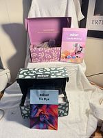 Both unopened craft kits with instruction booklets visible