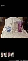 Three vases: pink flared, clear pressed, blue ribbed