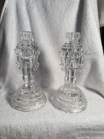 Pair of clear crystal toy soldier candlesticks front view