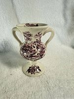 Front view of small twin-handled Tonquin Plum vase