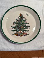 Front of plate showing Christmas Tree design and green rim
