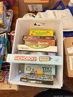 Top-down view of tub showing all seven game boxes