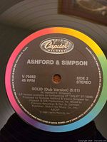 Label close-up showing Capitol logo, artist, track, catalog V-75082, 45 RPM, 1984.