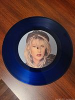 Side showing portrait label of Sarah Dallin on blue vinyl