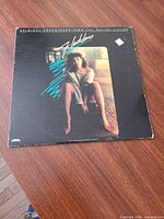 Front of album jacket on wooden surface