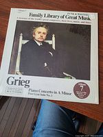 Front cover sealed in shrink wrap showing title and portrait