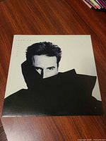 Front album jacket featuring John Waite portrait