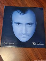Front picture sleeve with Phil Collins portrait