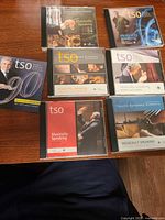 Seven Toronto Symphony Orchestra CD cases laid out on table
