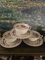 All three teacup and saucer sets stacked for overview