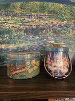 Both tins side by side for size and design comparison