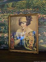 Full view of framed color lithograph portrait in gilt frame