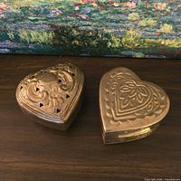 Both heart-shaped boxes closed