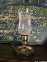 Front view of chamberstick with glass shade assembled