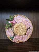 Top view showing full hat, brim and silk flower trim