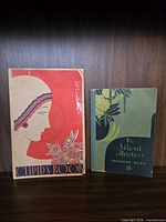 Front covers of both booklets standing upright