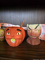 Orange pumpkin bucket and monster head decoration