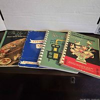 Four cookbooks laid out side by side