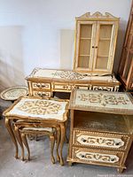 Group shot showing all seven Rococo-style pieces together