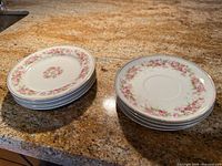 Stacked view of both short piles of the rose garland plates