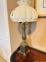 Full view of lamp showing base, column and glass shade