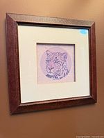 Square frame with leopard portrait print