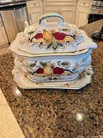 tureen assembled with lid and underplate showing hand-painted fruit motif