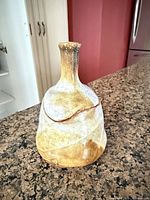 Angled exterior view of stoneware jar showing glaze and shape