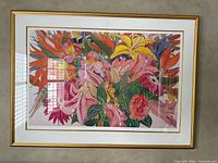 Full view of framed floral print showing artwork, mat and gold frame