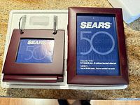 Keepsake box set shown in original foam tray: wood photo album and separate photo frame with Sears 50 inserts