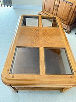 Top view showing four glass insets and wood finish