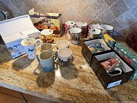 Overall view of countertop with assorted mugs and some gift boxes