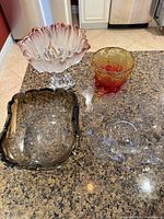 All four glass pieces grouped on countertop