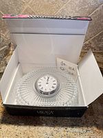 Clock in open Mikasa box showing cut crystal body and quartz insert