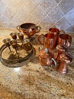 Overall view of all copper and brass pieces