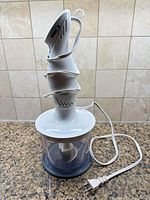 Full view of assembled chopper with motor unit, bowl, cord and plug