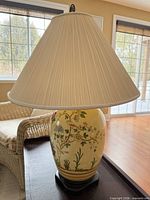 Lamp showing ceramic body, shade and finial