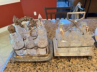 Both cruet stands side by side showing overall design and bottles