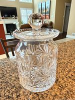 Full view of covered crystal jar on countertop