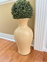 Cream/beige glossy ceramic floor vase with faux greenery
